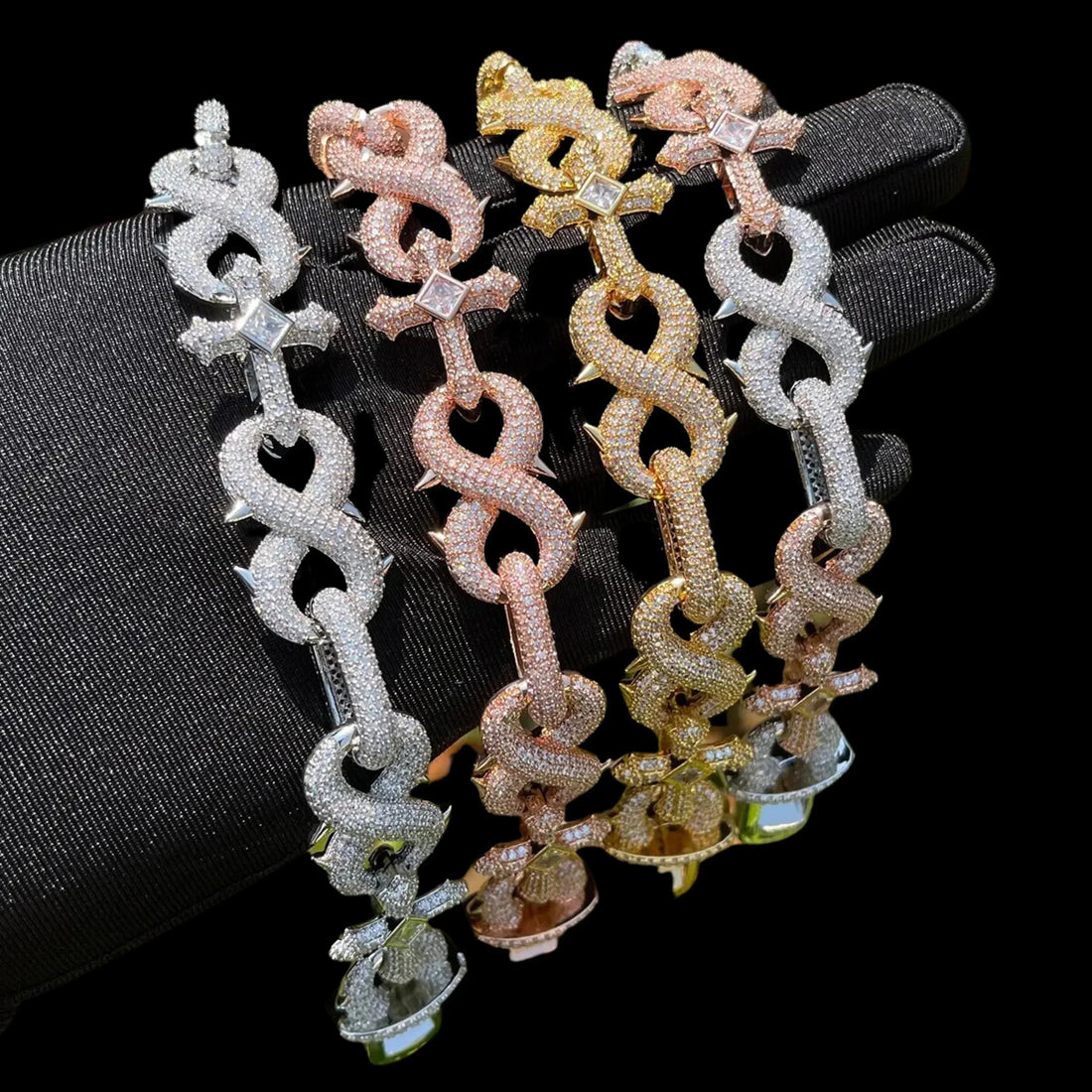 CARATIX Infinity Cross Linked Iced Out Bracelet shown in a color-option context