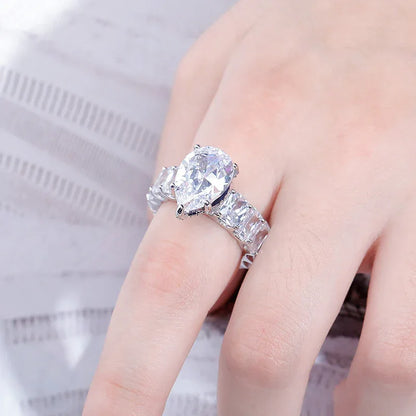 Women's Iced Out Pear Shape Ring | Teardrop Motif Pave Band | Caratix