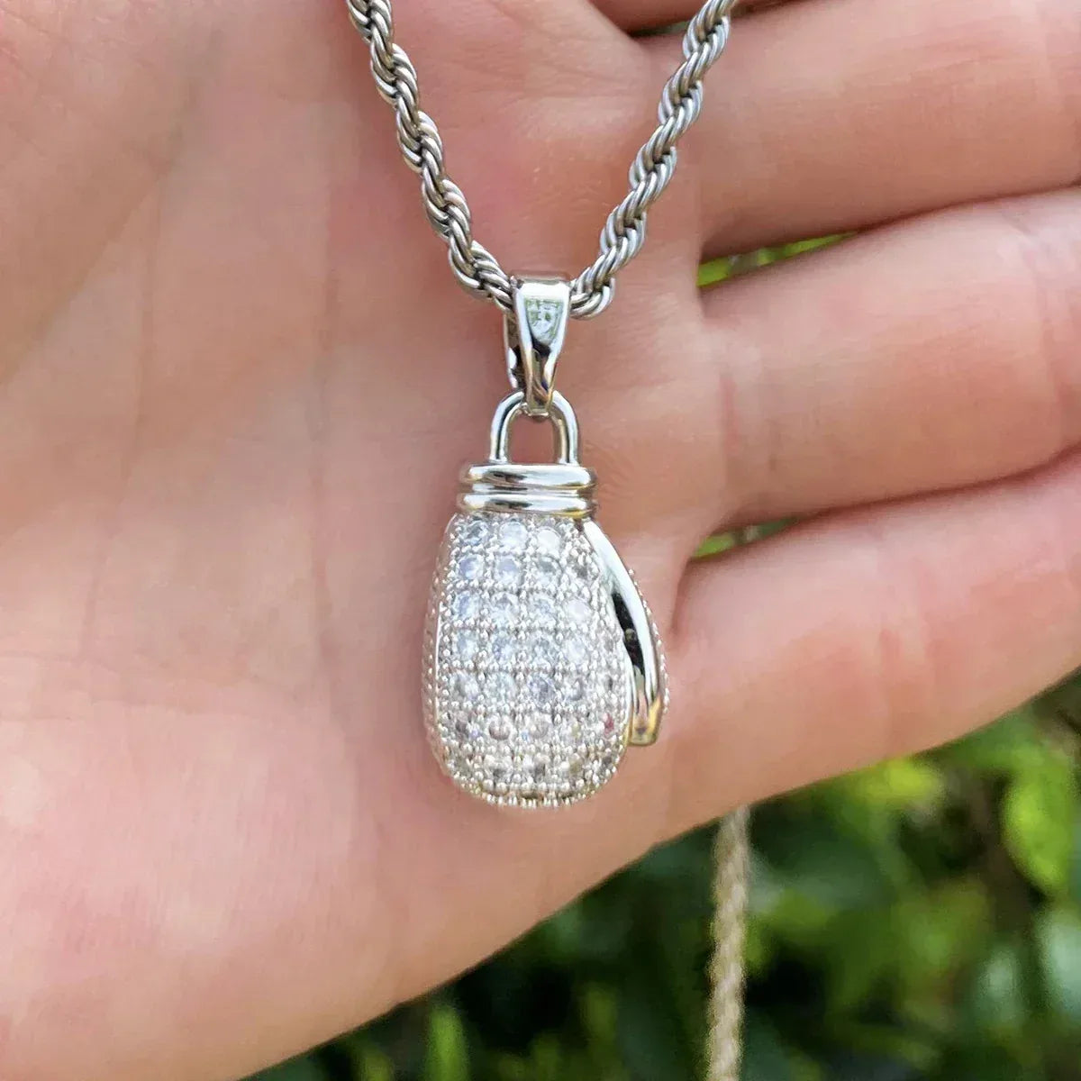 Iced Out Power Fist Pendant | Men's Real Copper CZ Strength Necklace - CaratixJewelry